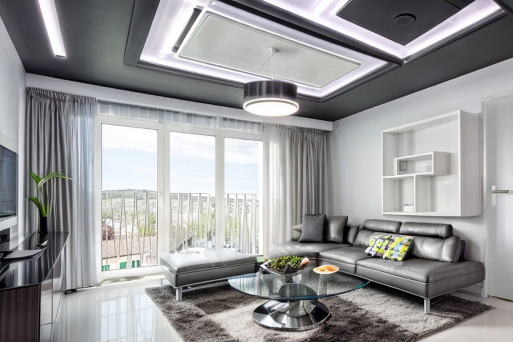 Example of a futuristic living room with a bar stools, a counter-height table, and a storage bench